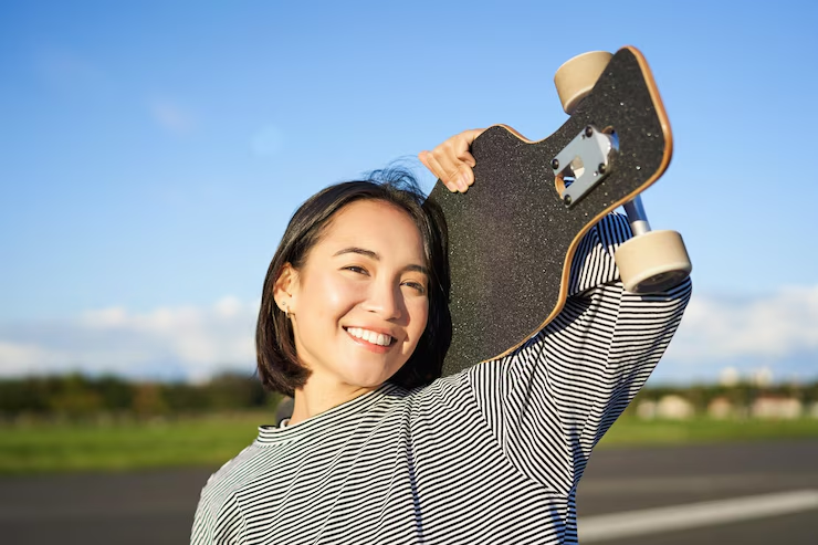 girl-holding-skateboard